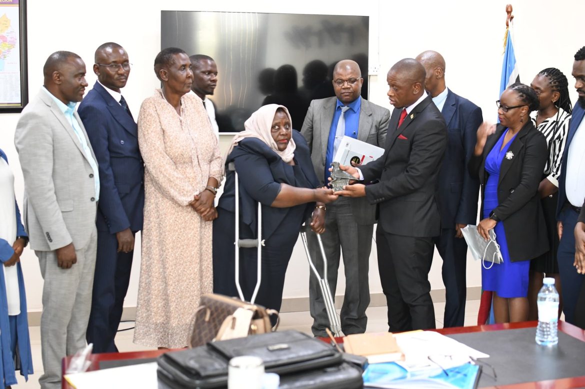 EOC Chairperson, Hon Safia Nalule Jjuuko receives a monument from the ZHEC delegation